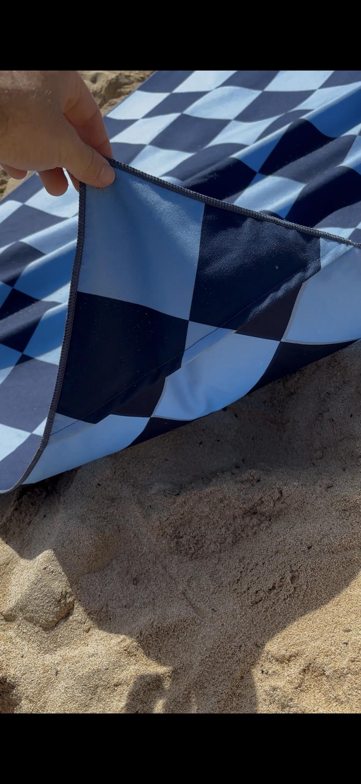 Windy Towel next to the shoreline